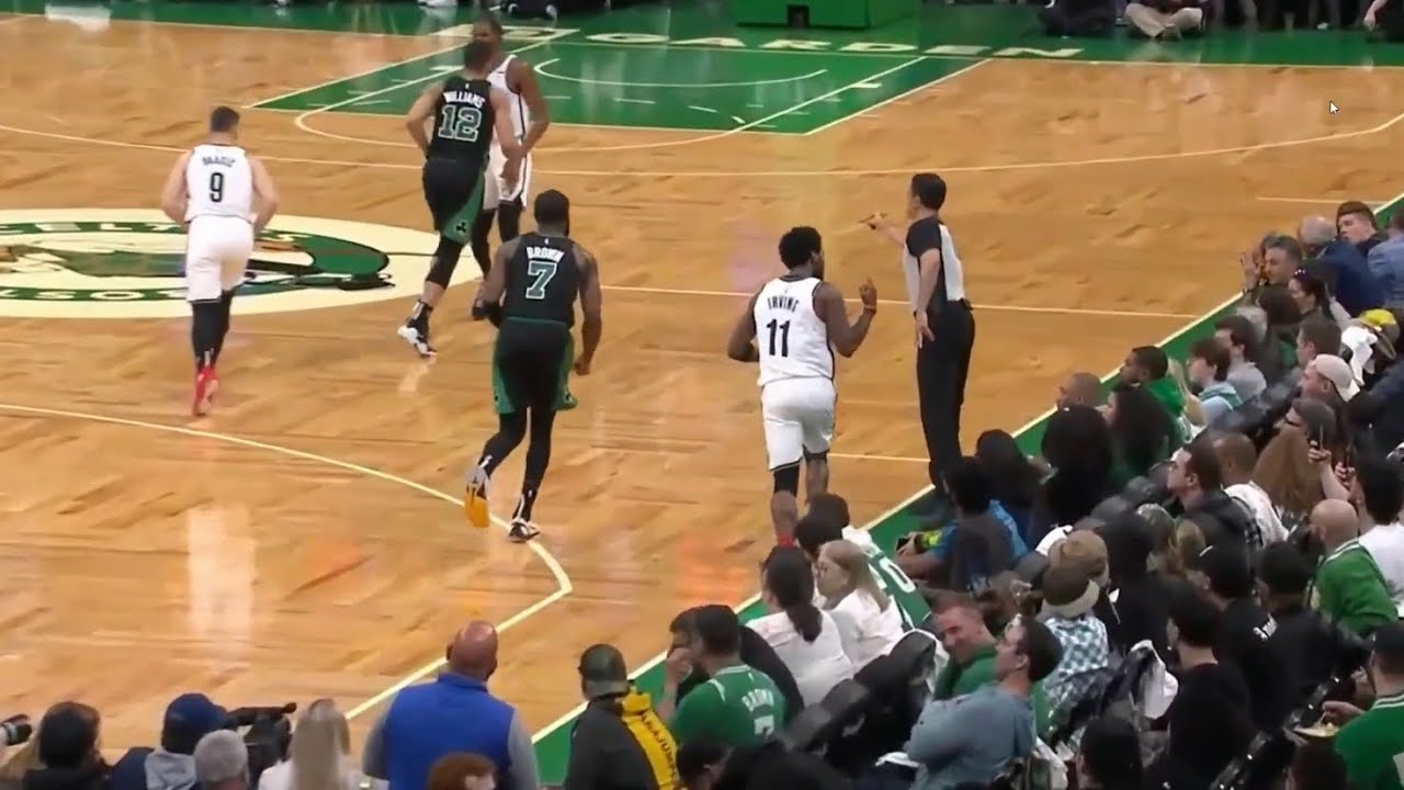 Kyrie Irving drains the shot and gives the Celtic fans the middle