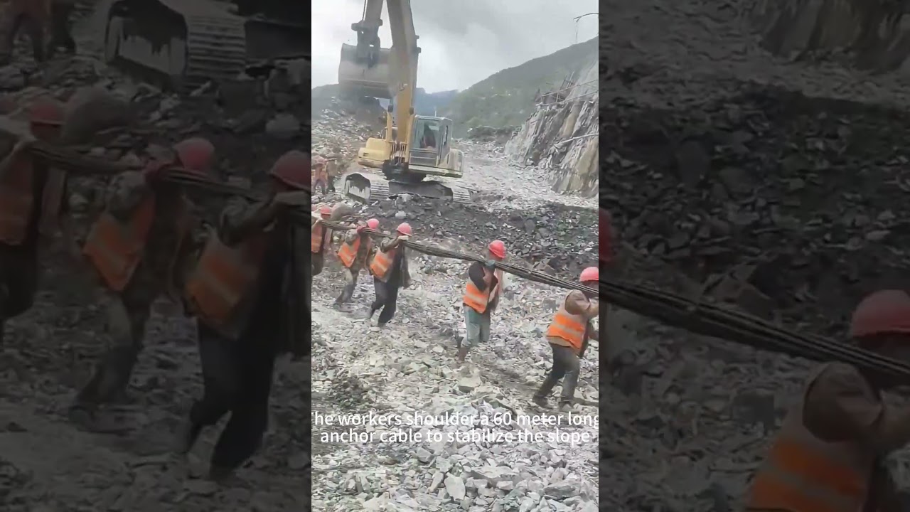Workers carry 60 meter long anchor cables on their shoulders to stabilize the slope