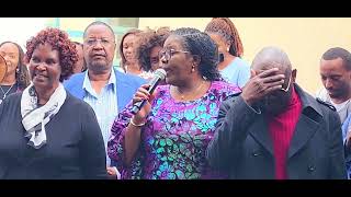 Singing with ACK Rev and members in Zachary Wandaro 's ordination service in Kabete.