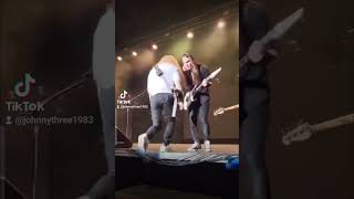 Up close POV of Dave Mustaine kicking out security for being too rough with fan who jumped onstage!