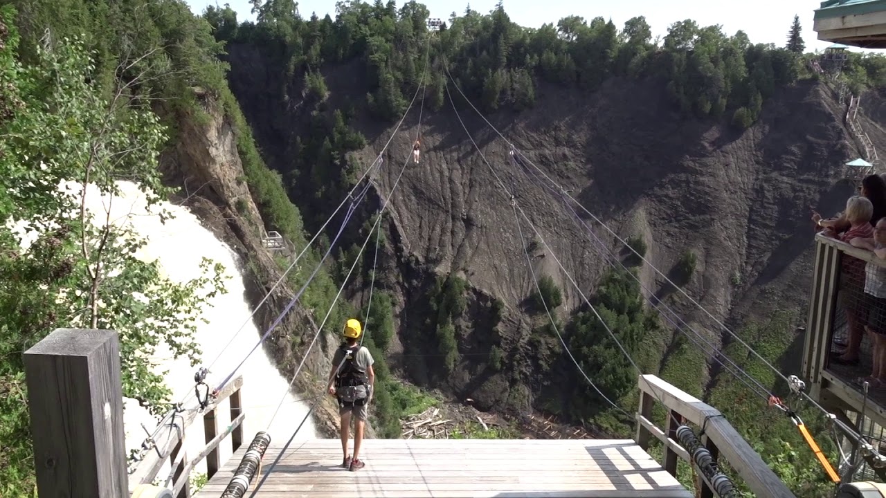 Zipline Rider Going Over The Montmorency Falls In Québec City YouTube