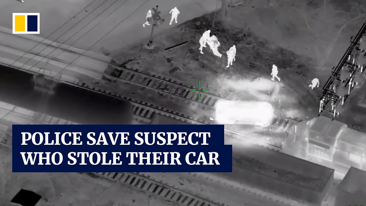 Dramatic moment when US police save suspect in stolen patrol car from ...