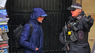 GET OUT! ARMED POLICE OFFICER tells IDIOT TOURIST who doesn