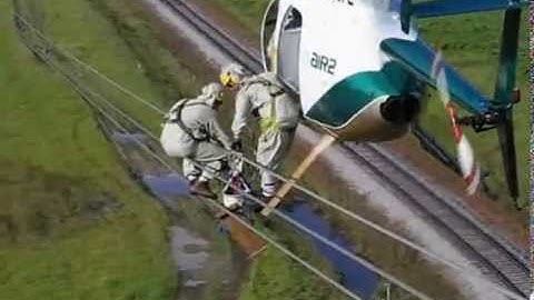 Helicopter Transfering Lineman to Wire