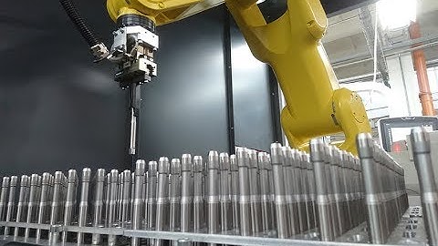 Robotic machine tool loading/unloading, automatic positioning