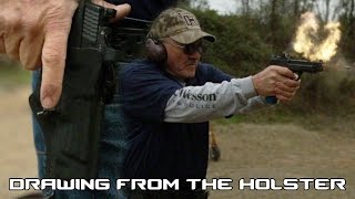 How to quickly draw out of a tactical holster with world record shooter, Jerry Miculek (60FPS)