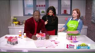 Kenny plays ‘Cupid’ as he surprises FOX 8 anchors for Valentine’s Day