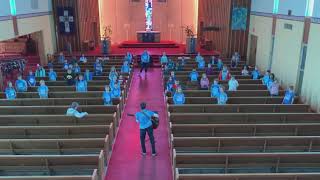 Trinity students practicing for Christmas program.