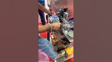 Automatic snap button attaching machine