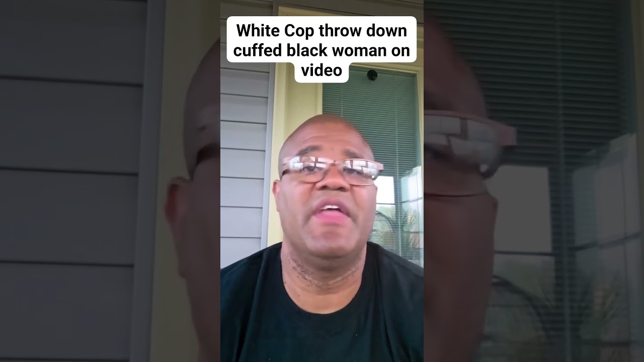 White Cop throw down cuffed black woman on video