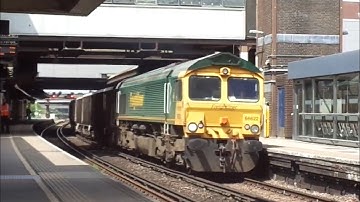 Class 66 freight train passes Gatwick Airport
