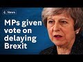 May offers MPs chance to delay Brexit