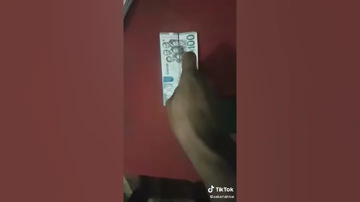 Tiktok - Hundred Ghana Cedis (Ghc 100) Cut into two parts with  a knife