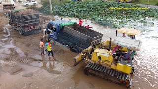 ឡានដឹកដី៥តោនជាប់ផុង Dump truck 5 ton struck in deep mud & recovery by Komatsu Bulldozer