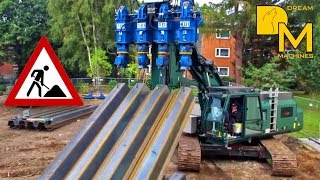 Pile driver pressing massive steel sheet piles into the ground Sennebogen ABI TM18