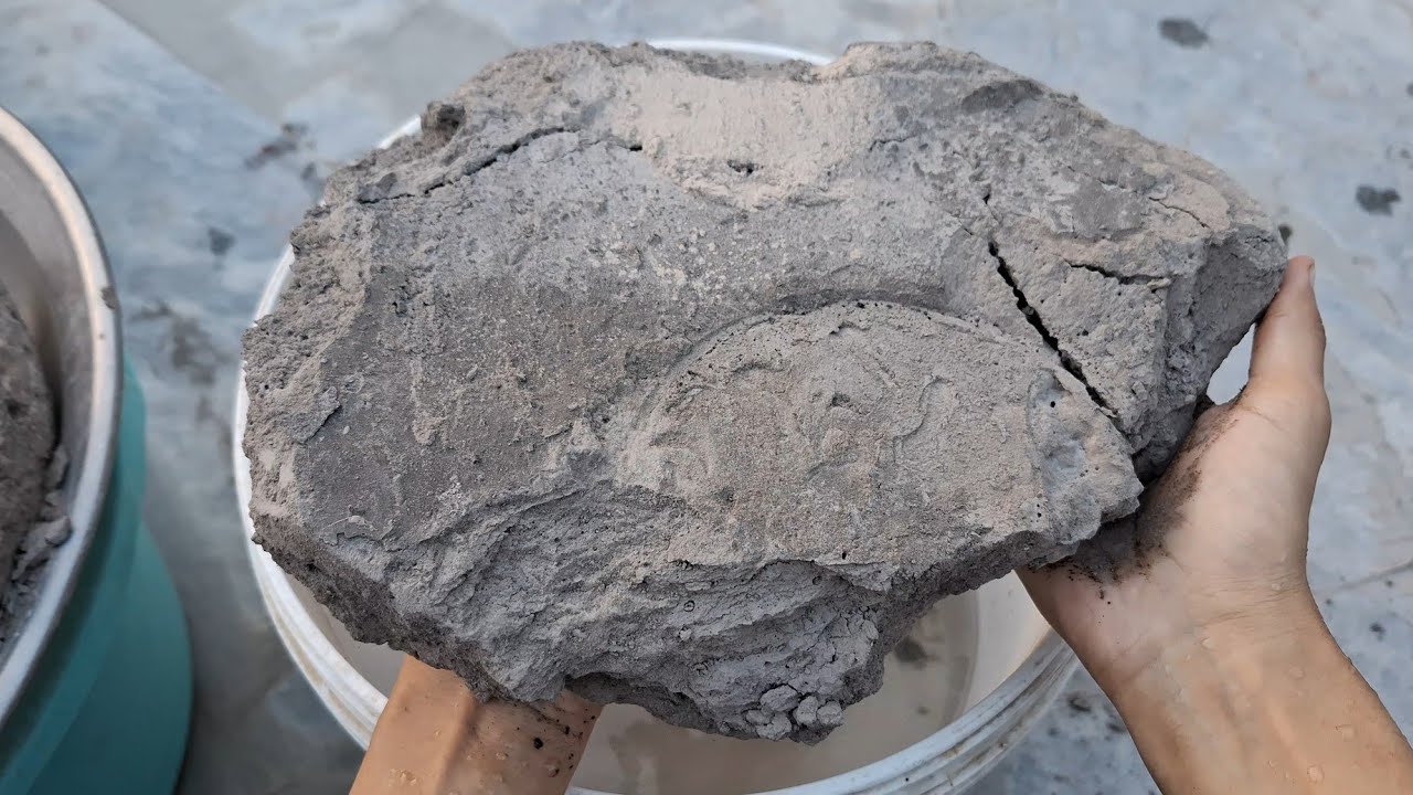 New video Black dirt crumbling in water bucket satisfying