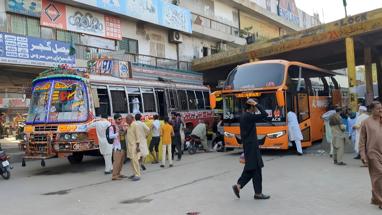  🇵🇰 Daily Life in Biggest Lari adda of Pakistan | Biggest Bus Terminal | 4k 60fps walking Tour |