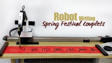 Robots show calligraphy skill by writing Spring Festival couplets in E China
