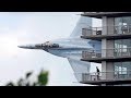 Crazy fighter jet pilot low pass between australian city buildings