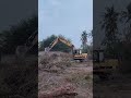 CAT E120B Excavator Performing Land Clearing and Brush Removal