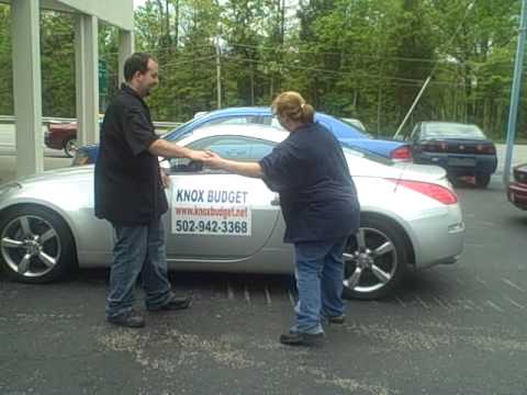 Jack and Jessica dancing with used cars at Knox Bu...