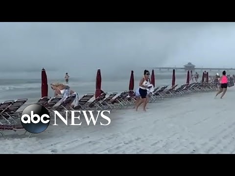 Waterspout sends beachgoers scrambling