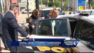 Woman arrested after 11 cats found dead, dozens rescued from Brookline house