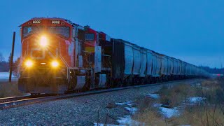 CN EMD leading CPKC Grain Train! CN 8302 South CPKC 303 Near Ponoka Alberta. CPKC Leduc Subdivision.