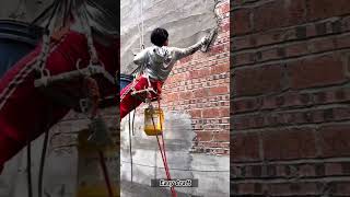 Vertical Wall Plastering via Rope Suspension