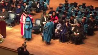 Gregg's hooding at graduation.