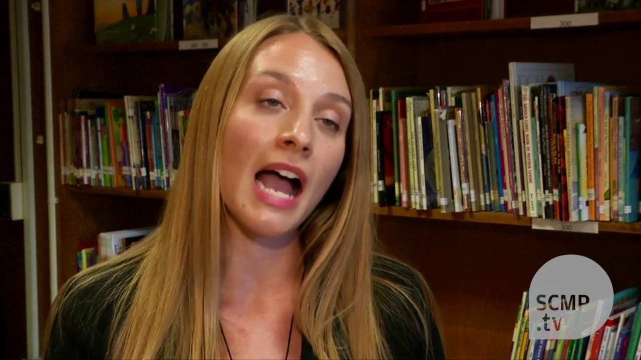 Therapy dogs help New York immigrant kids clear reading hurdles - YouTube