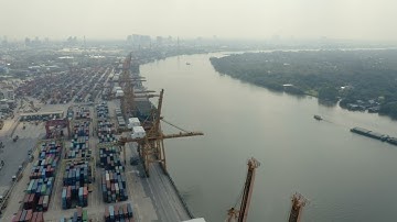 Container Port Cranes by River | Drone View | Drone Shots
