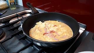 Preparing an omelette for breakfast