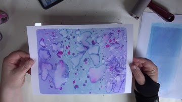 Making backgrounds using distress inks and Dylusions ink sprays on a geli plate.