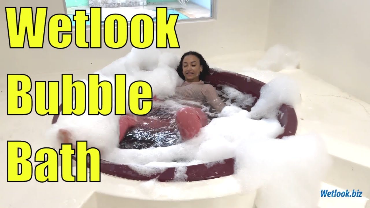 ⁣Wetlook girl in pink clothes enjoying a bubble bath | Wetlook Golf | Wetlook sweatpants