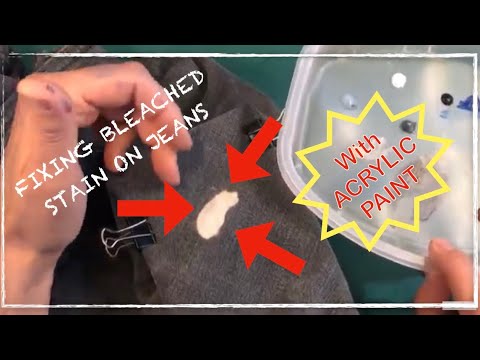 Fixing bleached spots on the gray jeans.