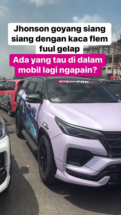 What is Miss Mandut doing with her husband in the car?