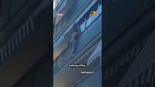 Man rescues child dangling from balcony
