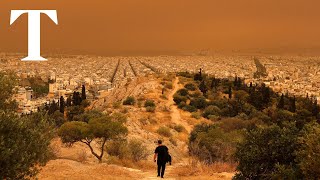 Athens skies painted orange by Saharan dust clouds Athens skies painted orange by Saharan dust clouds