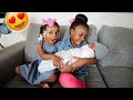 THE GIRLS HOLD THEIR NEWBORN BROTHER FOR THE FIRST TIME!!