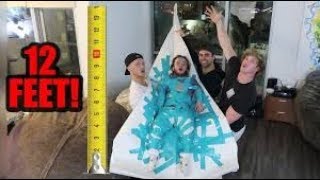 DWARF ATTACHED TO 12 FOOT PAPER AIRPLANE will it fly