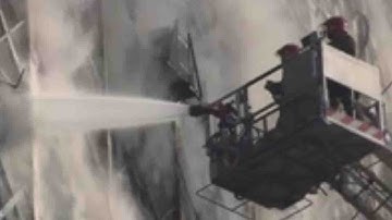 Iran’s oldest high-rise building in Tehran crumbles after fire