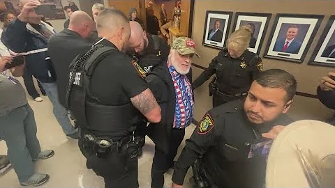 Three detained at Tarrant County Commissioner's Court during briefing on jail deaths