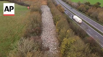 Hundreds of tons of waste illegally dumped in field in southern England