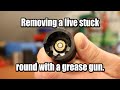 Removing a stuck case with a grease gun