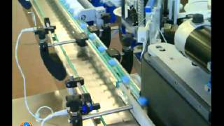 labeling machine to apply wraparound label on BOTTLES.avi