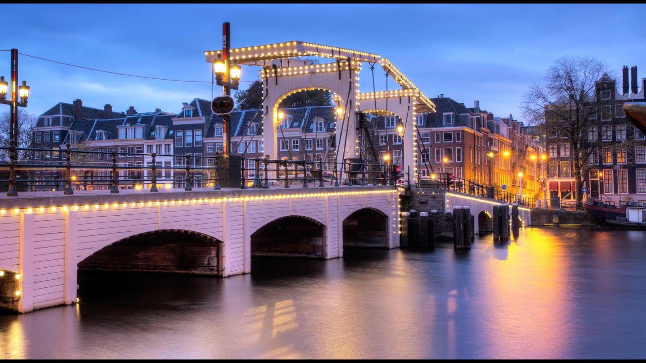 Амстердам время. Мост magere brug в Амстердаме. Нидерланды достопримечательности. Главные достопримечательности Нидерландов. Картинки Нидерланды достопримечательности.