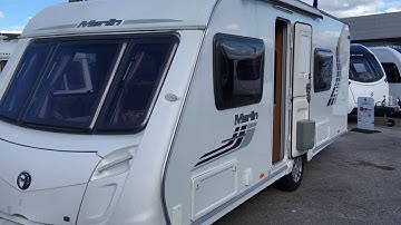 Swift Merlin 550 2011 fixed bed rear washroom. For sale at North Western Caravans .