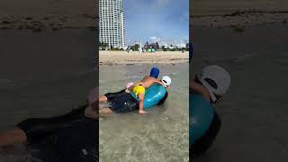 Family Beach Shorts! Kids having fun in the ocean on Miami beach
