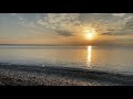 October 2021 - Antalya, sea at sunrise and fishermen on the beach, Turkey 4K